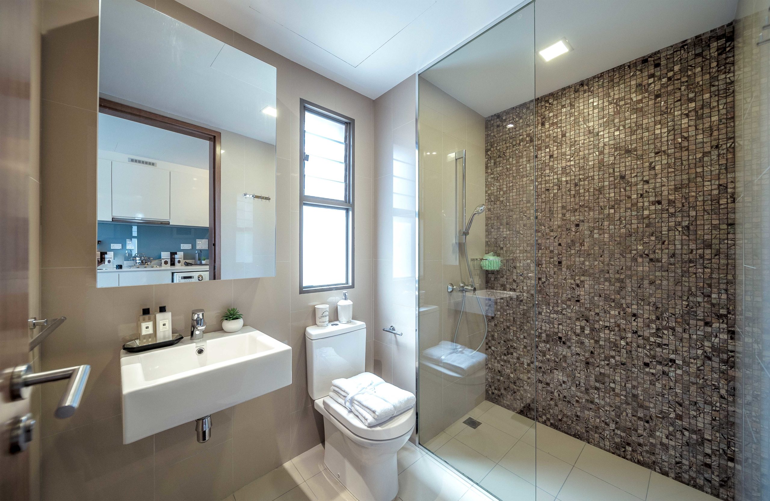 Luxury Toilet Interior Design with Bronze Reflective Tiles