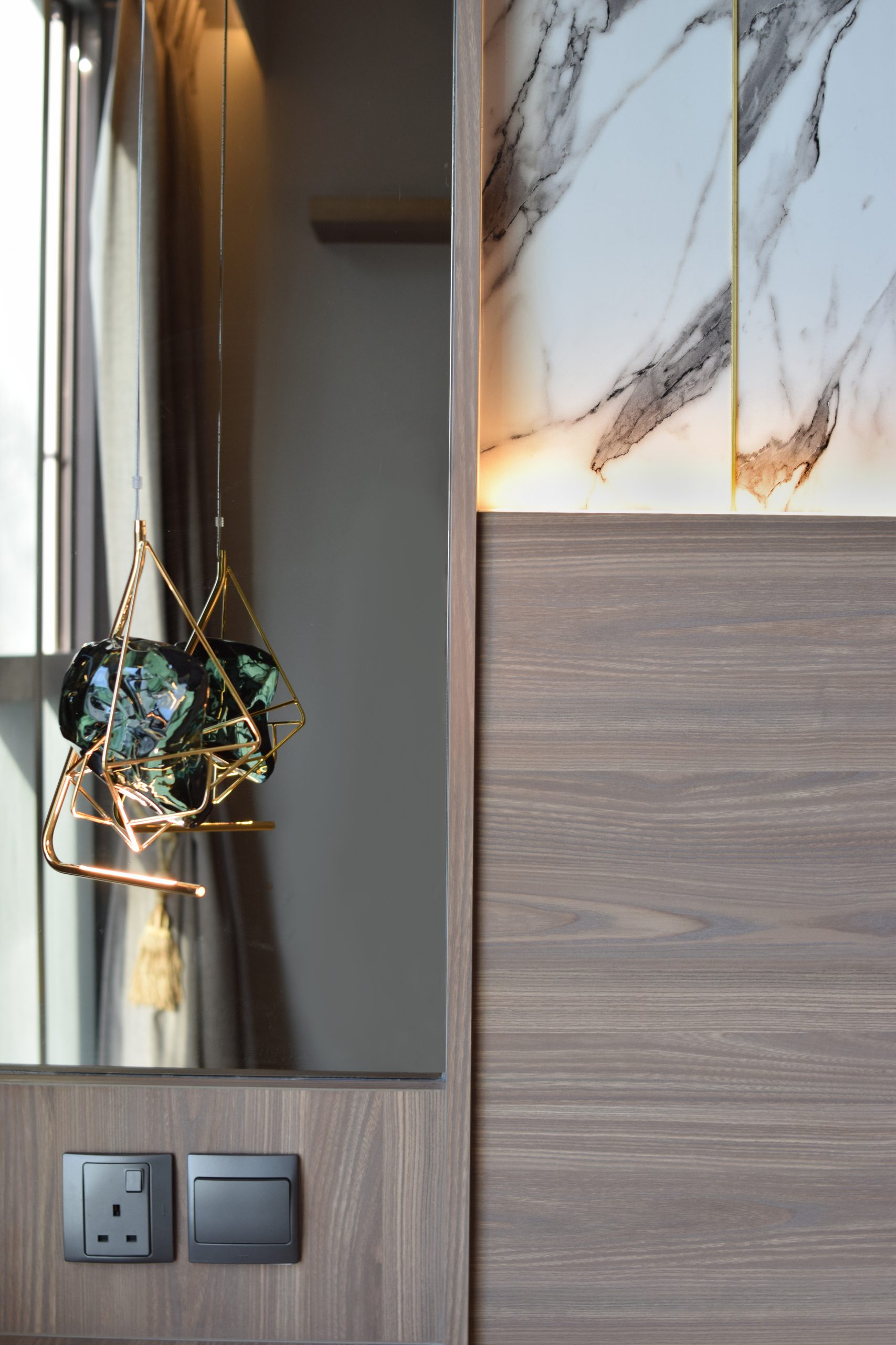 Bedside mirror and pendant light for modern luxury condo interior design