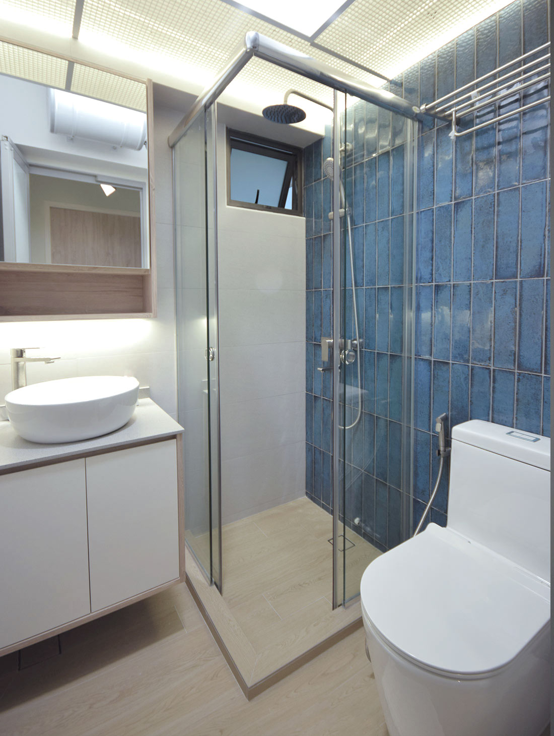4 Room HDB resale dawson singapore wabi sabi interior design toilet renovation shower with blue subway tiles custom made vanity and overmount sink