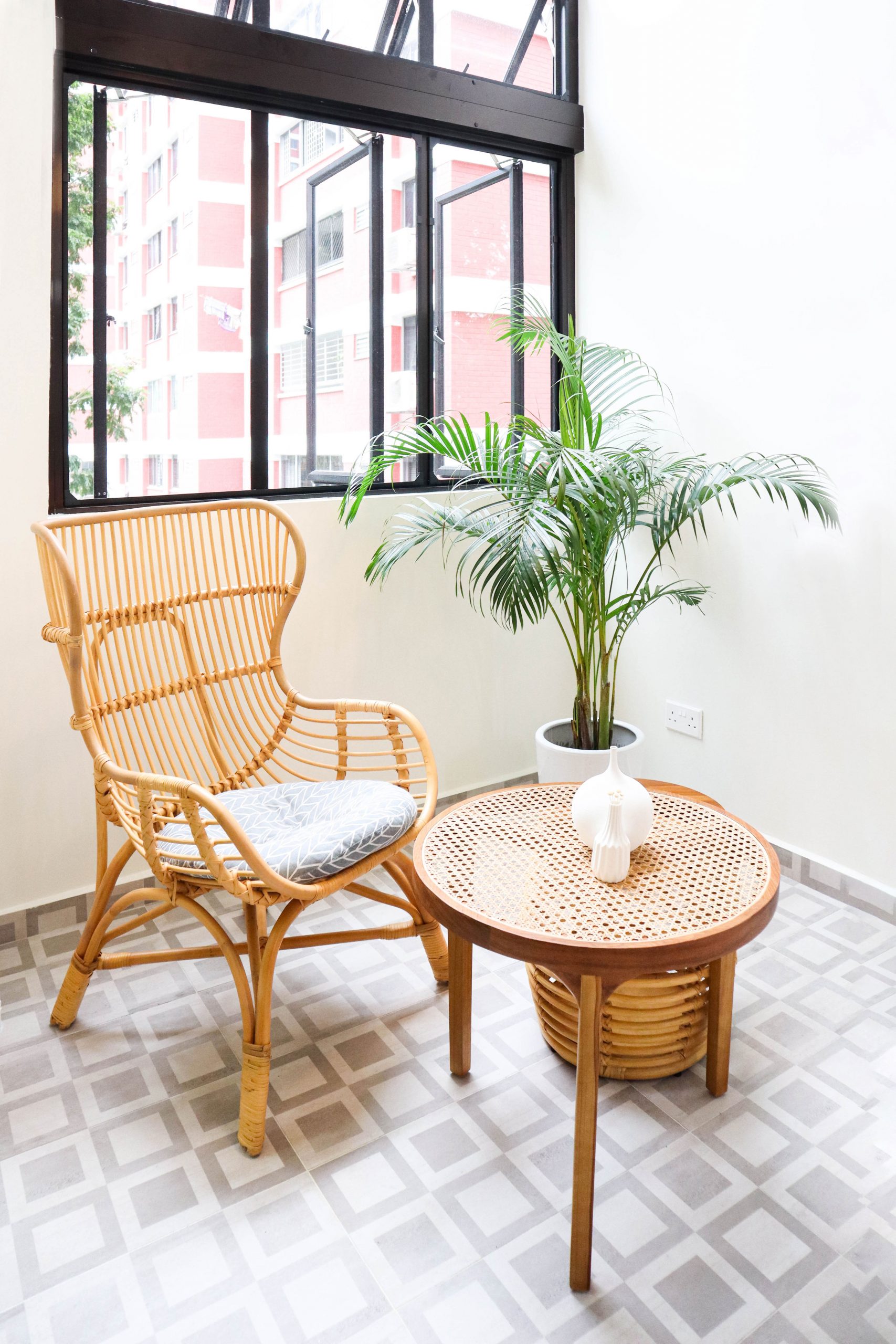 Toh yi Drive HDB Maisonette Balcony Cosy, Asian Inspired Interior Design with Rattan Chair and Coffee Table