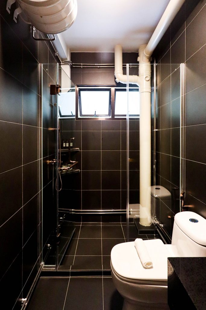 Renovation of HDB resale Bathroom in Black Tiles and white Grout Toh Yi Drive