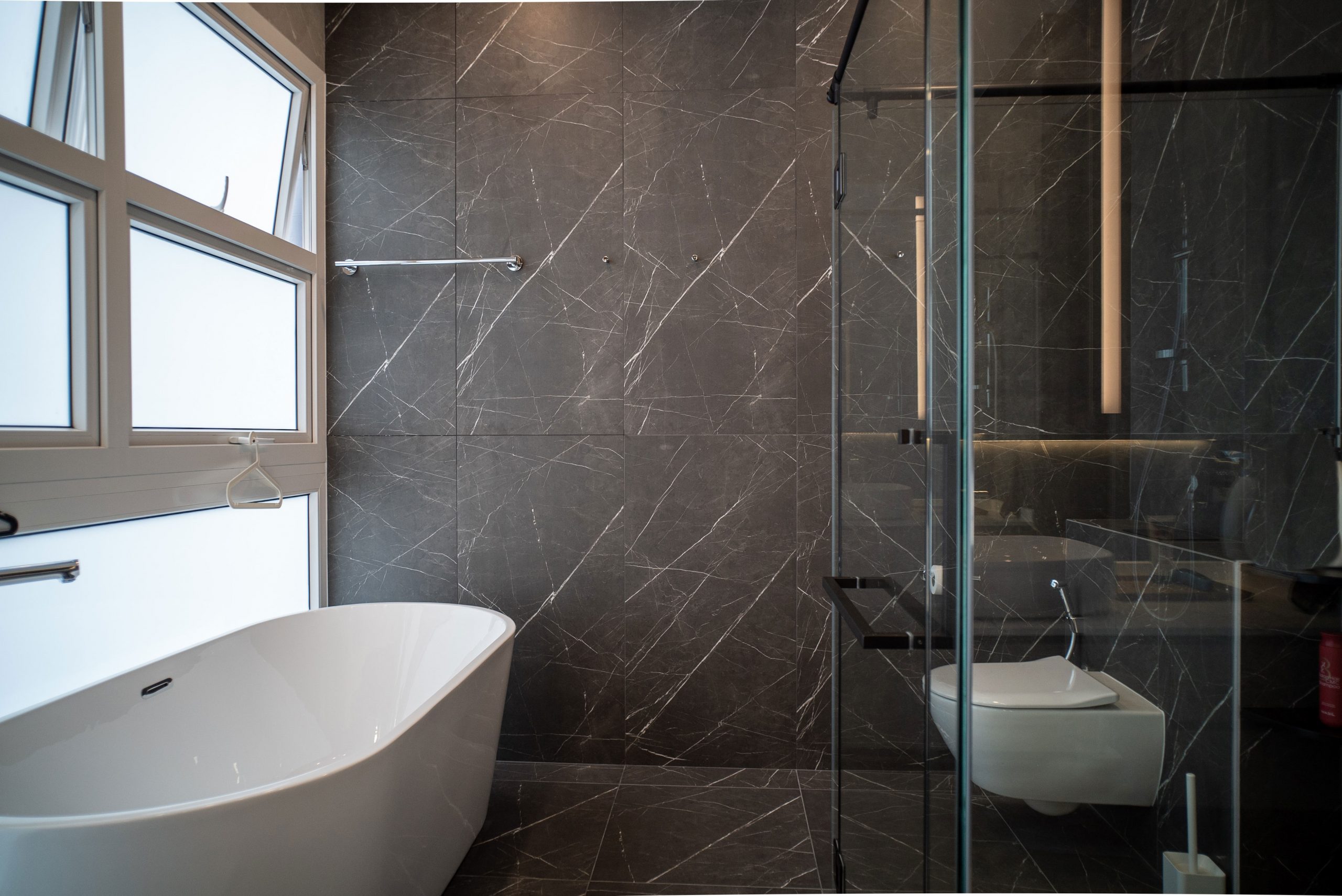Bath tub and shower stall wc toilet interior design in black marble Minotti inspired interior design