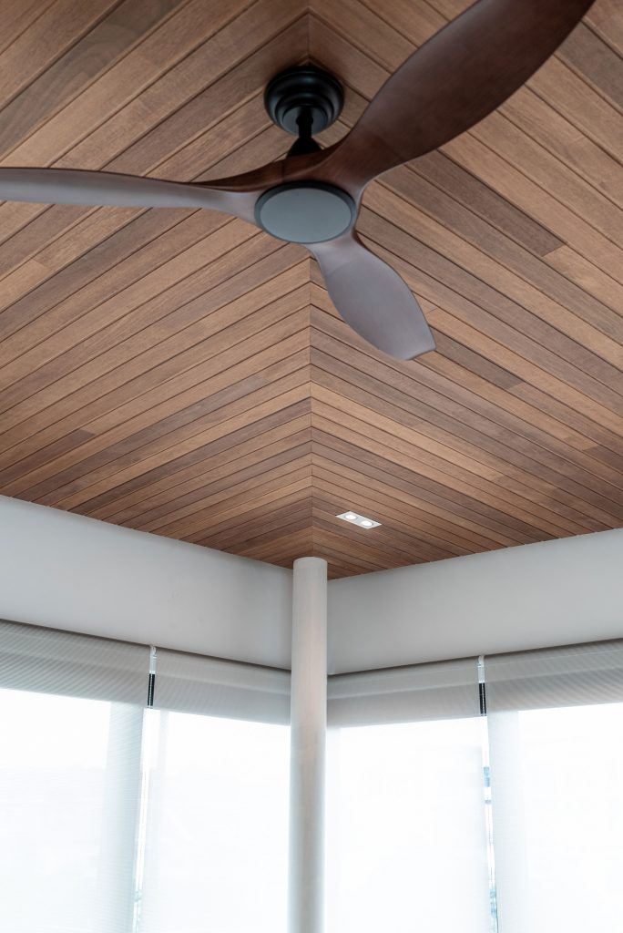 Ceiling fan with ceiling wood panelling